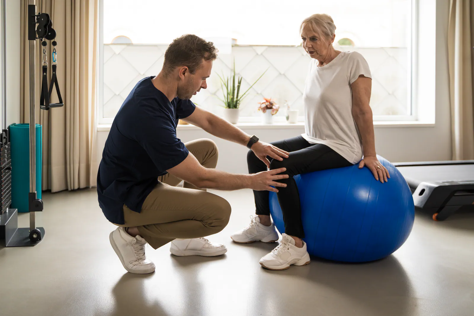 Person using movement and recovery strategies for desk setup for lower back pain
